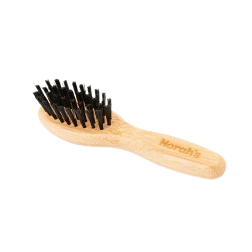 Norah's bristle brush for grooming small animals like rabbits and guinea pigs

